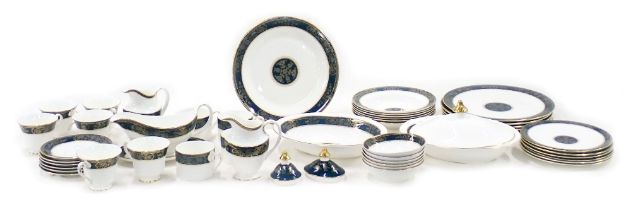 A Royal Doulton Carlyle pattern dinner and tea service, to include, plates etc.