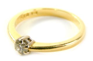 An 18ct gold diamond solitaire ring, with round brilliant cut diamond totalling 0.25ct, in a six cla