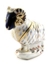 A Royal Crown Derby porcelain ram paperweight, gold button and red back stamp.
