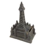 A late 19thC/early 20thC cast iron money box, modelled in the form of Blackpool Tower, 19.5cm high.