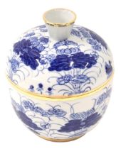A Japanese blue and white jar and cover, with blue floral design and gilded border, with four charac