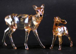 A Swarovski crystal deer and a fawn, boxed.