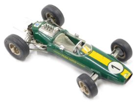 A Schuco 1071 model of a Lotus Climax 33 Formula 1 racing car, numbered 1 to the bonnet, and label f