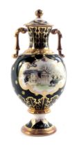 A Royal Crown Derby porcelain two handled vase and cover, painted with a scene of Tatton part on a g