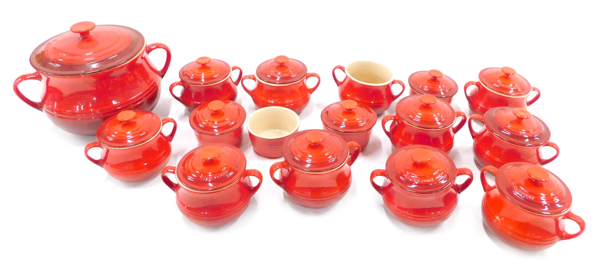 A quantity of Le Creuset oven to table ware, to include small tureens, covers, a larger example, eac