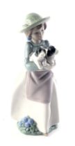 A Nao figure of a girl carrying puppies, 26cm high.