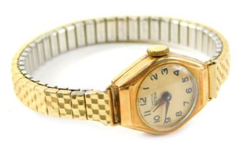 A 9ct gold Smiths Astral lady's wristwatch, with a silvered numeric dial and blue hands, 1.5cm wide,