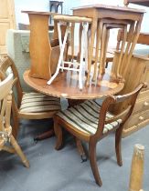 A reproduction plum pudding style circular kitchen table, three chairs with drop in seats, nest of t