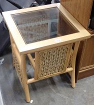 A beech lamp table with brush effect sides.