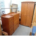 A hardwood bedroom suite, comprising two door wardrobe, tall five drawer chest, chest of four long a