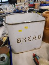 An enamel bread bin, in white.