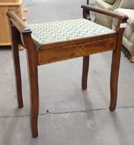 A mahogany piano stool, with tapestry seat.