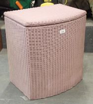 A pink Lloyd loom linen basket.