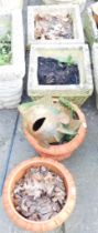 Various reconstituted stone garden planters, comprising two square set examples with lapis borders,