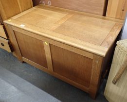 A light oak blanket box.