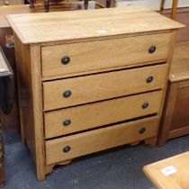 A beech effect four drawer chest of drawers.