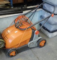 A Flymo Lawn Rake Compact 3400.