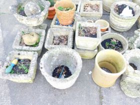 A large quantity of stoneware garden planters, comprising a set of three lattice planters, two lobed