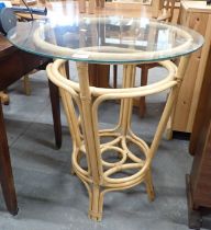 A cane conservatory table, with circular top.