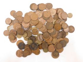 A group of pre-decimal pennies and half pennies.