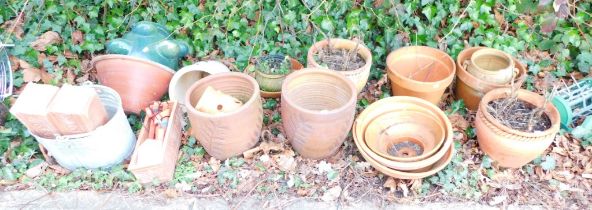 A quantity of terracotta planters, a bin and galvanized bucket.