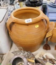 A stoneware three handled planter.