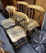 A set of four pine stick back kitchen chairs.