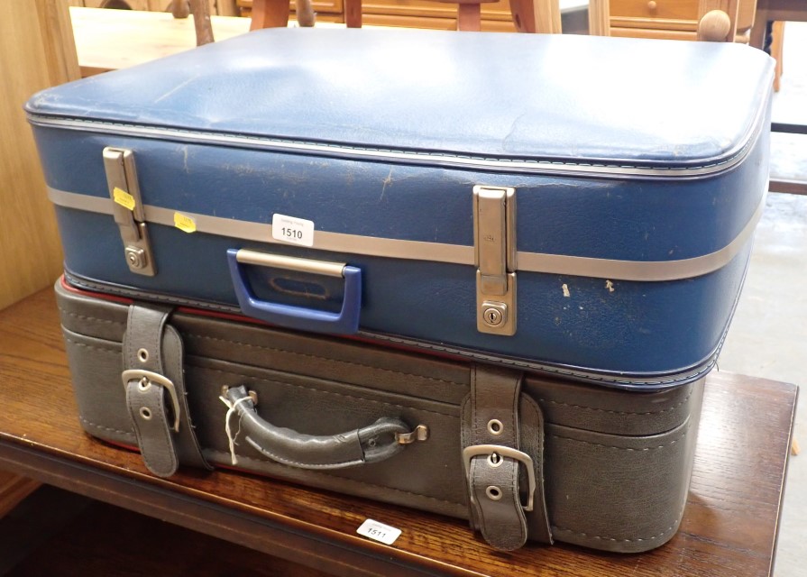 Two material suitcases.