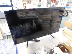 A 40" Logic flat screen television and remote.