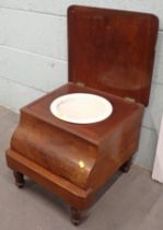 A 19thC mahogany box commode with tapestry inset top.