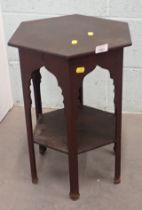 A mahogany hexagonal topped side table.