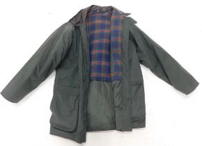 A size 42 gentleman's green over coat, with chequered lining.