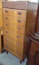 A 1920s tall chest of seven drawers, with roll top.