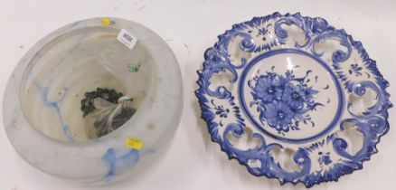 A Delft blue and white charger, and an Arts and Crafts light shade.