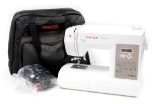 A Singer Brilliance electric sewing machine, model number 6180, serial number H16119M55516485, bagge