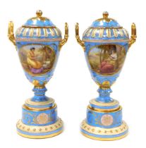 A pair of 19thC Vienna style porcelain vases and covers, of twin handled ovoid form, raised on a pli