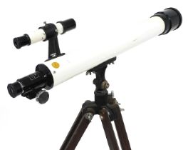 A Unicon night telescope, with a F=600mm, D=50mm lens, on a wooden tripod.