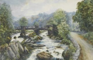 British School (early 20thC). Country landscape with a bridge over a flowing river, watercolour, 35c
