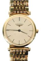 A Longines La Grande Classique lady's gold plated wristwatch, with a circular champagne dial, quartz