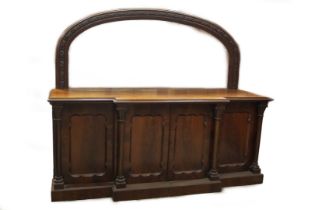A Victorian mahogany mirror back breakfront sideboard, with floral carved and double moulded arched