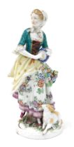 A late 19thC Samson porcelain figure, of a shepherdess, holding a tambourine, with a lamb at her fee