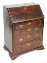 A George III mahogany and crossbanded bureau, stamped S.William & Sons Guildford, of small proportio