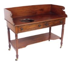 A Victorian mahogany wash stand, with a galleried top, and bowl recess, over two frieze drawers, rai