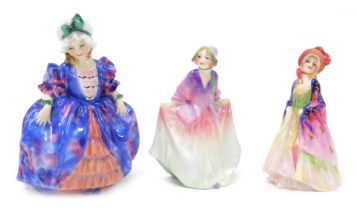Three Royal Doulton figures, modelled as Claribel, HN1950, Sweet Anne M5, and The Paisley Shawl M4.