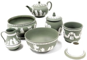 A group of Wedgwood green Jasperware, including two fruit bowls, small jardiniere, and a teapot, tog