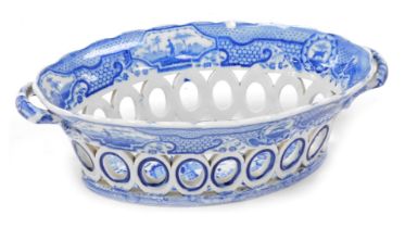 An early 19thC Spode blue and white pottery chestnut basket, decorated in the Gothic Castle pattern,