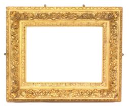 A Victorian gilt wood and gesso picture frame, decorated with flowers and scrolling leaves, 83cm x 9