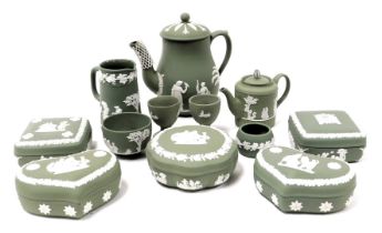 A group of Wedgwood green Jasperware, including dressing table boxes and covers, coffee pot and cove