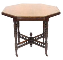 A Victorian mahogany octagonal window table, raised on turned legs united by a galleried X frame st