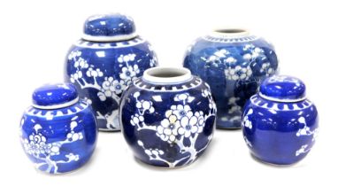 A 19thC Chinese blue and white ginger jar, decorated with prunus blossom against a scale ground, and